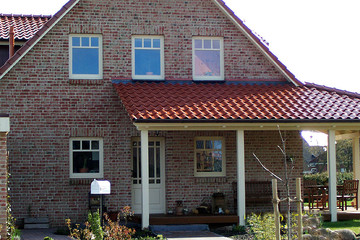 A single-family house covered with copper engobe Bornholm tiles