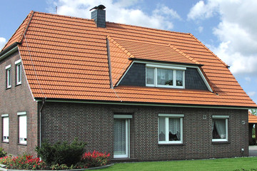 A single-family house covered with natural red Elsss tiles