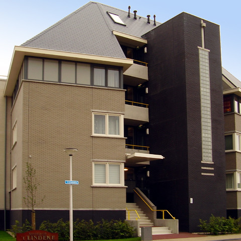 A residential building made of gray and black smooth shaded Faro brick
