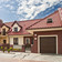A single-family house covered with chestnut engobe Monza roof tile