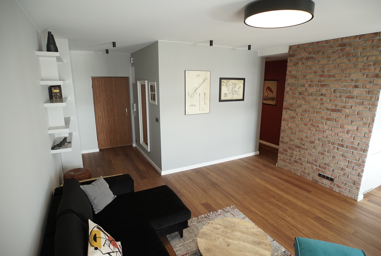 Living room with a brick wall